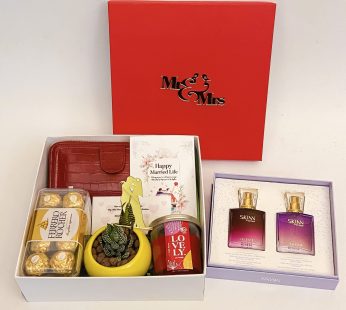 Premium wedding gift hamper with the Couple Perfume , Plant and more with blissful greetings!
