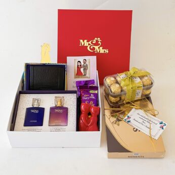 Premium wedding gift hamper with the Couple Perfume ,Chocolates and more with blissful greetings!