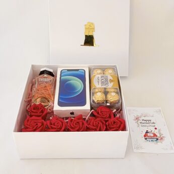 Luxury wedding gift hamper with the Perfume , iPhone 12 and more with blissful greetings!