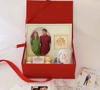 Elegant wedding gift hamper with the Mug , Photo Frame and more with blissful greetings!
