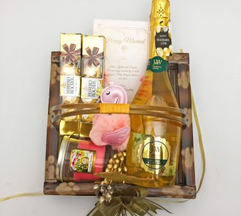 Beautiful wedding day hamper with wine, Chocolates and more with blissful greetings!