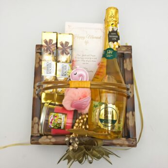 Beautiful wedding day hamper with wine, Chocolates and more with blissful greetings!