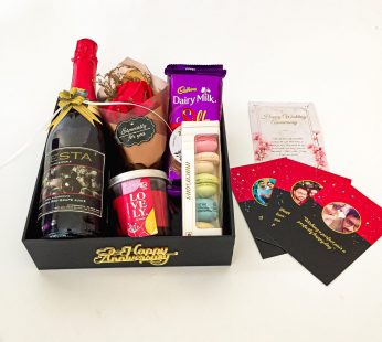 Elegant anniversary gift hamper , Looking for the perfect anniversary gift for your wife? Then look no further. Surprise her with something romantic with a Wine , Macrons and blissful greetings
