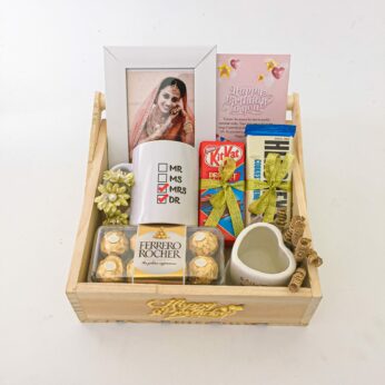 Elegant birthday surprise box with Mug, Chocolates and a sweet greetings.