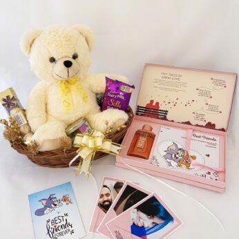 Elegant Birthday gift hamper with teddy bear, scented candle and a sweet greetings.