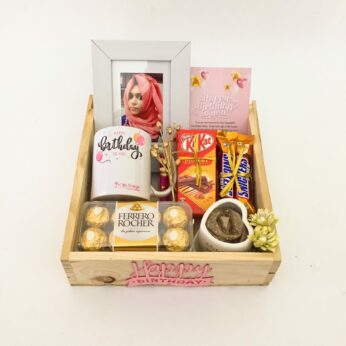 Elegant Birthday gift hamper with lovely Frame, Chocolates and a sweet greetings.