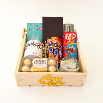 Elegant Birthday gift hamper with Chocolates ,Pot and a sweet greetings.