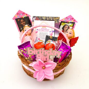 Adorable Birthday gift hamper with Chocolates, Barbey Dolls and a sweet greetings.