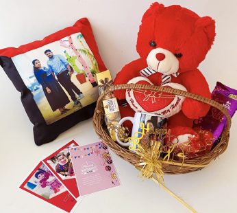 Delightful Birthday gift hamper with lovely customized pillow, teddy bear and a sweet greetings.