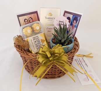 Adorable Birthday gift hamper with perfume, plant and a sweet greetings.