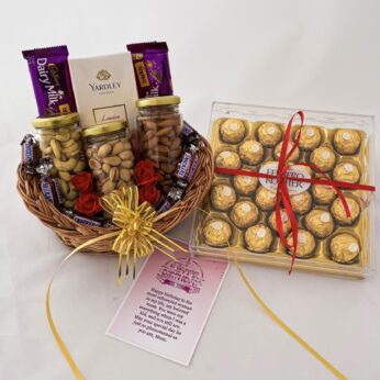 Delightful Birthday gift hamper with Tasty nuts bottles,snickers and a sweet greetings.