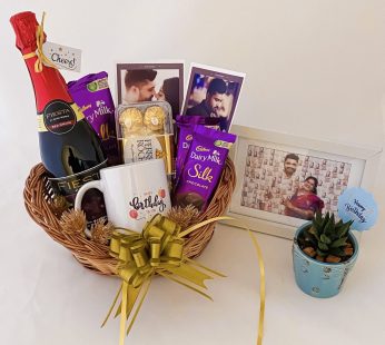 Delightful Birthday gift hamper with Tasty wine, mug and a sweet greetings.