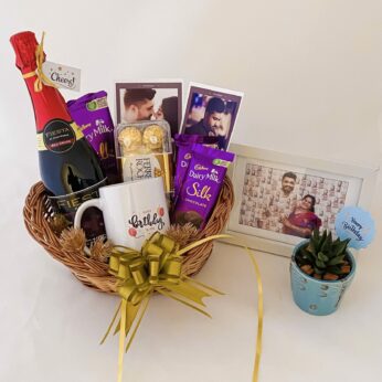 Delightful Birthday gift hamper with Tasty wine, mug and a sweet greetings.