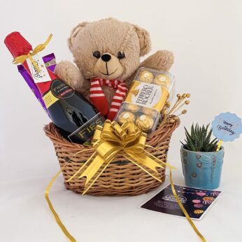 Unique anniversary gift for wife containing teddy, tasty wine, and chocolates