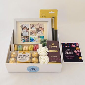 Elegant Birthday gift hamper with lovely frame ,macrons and a sweet greetings.