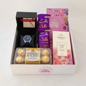 Special Birthday gift hamper with stylish watch, Chocolate and a sweet greetings.