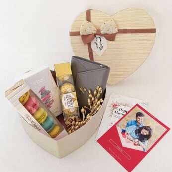 Elegant wedding hamper for bride and groom with the Perfume , Chocolates and more with blissful greetings!