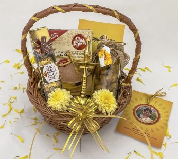 Cute onam gifts hamper basket with Nilavilakku and jaggery chips
