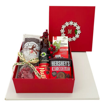 Corporate Christmas food gifts includes yummy cake, wine, hot chocolates, jelly and bean to berris