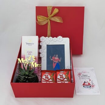 Beautiful wedding gift hamper with the Plant, Perfume and more with blissful greetings!
