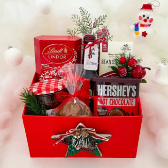 Celebration new year gift ideas in a red gift box includes many chocolates and wine