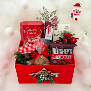 Christmas corporate gift hampers includes Lindt milk chocolate, Jam, Sparkling wine, Christmas cookies and more