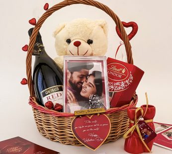 Charming valentine’s day week gift hamper with elegant Teddy, Wine, Frame, and Cards