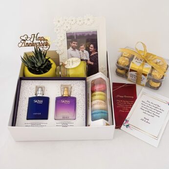 Adorable Anniversary gift hamper with Perfume, Chocolates, Plant With Pots And Frames