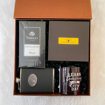 fashionable birthday gifts hamper for him filled with a body spray, and men’s belt