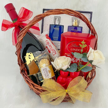 Anniversary gift basket for parents filled with a variety of elegantly packed items From Wine 750ml, couple perfume, Chocolates and more