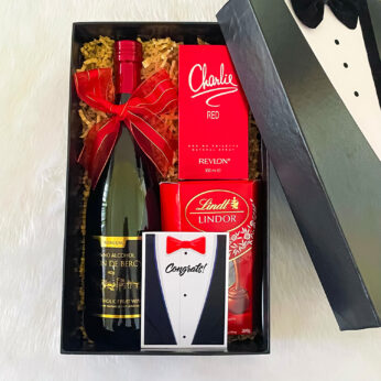 Finest gift for groom on wedding day with red wine and perfumes