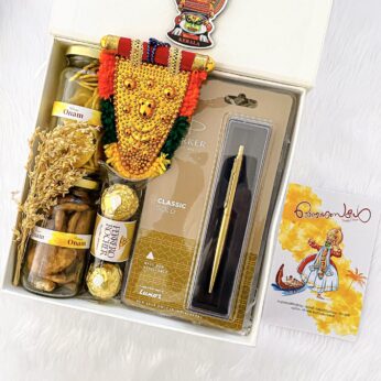 Traditional Onam Gifts and hampers with banana chips and handcraft nettipattam