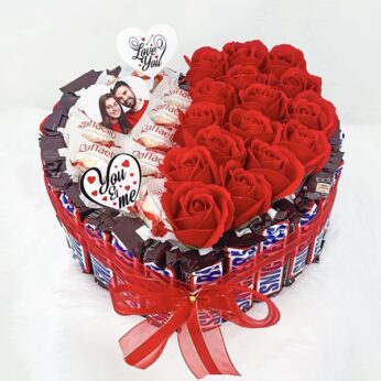 Enchanting love gift for wife adorned with artificial flowers and chocolates