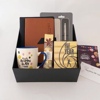 Stylish birthday gift hampers for him in India with a pocket diary, pen, and chocolates