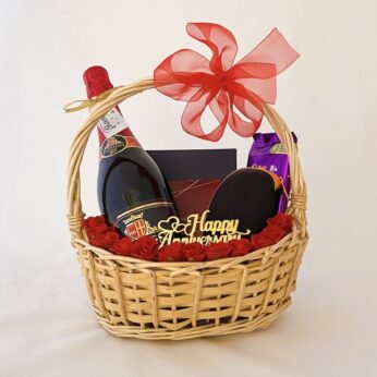 Surprise Anniversary gift basket for boyfriend adorned with grape juice, wallet, & more