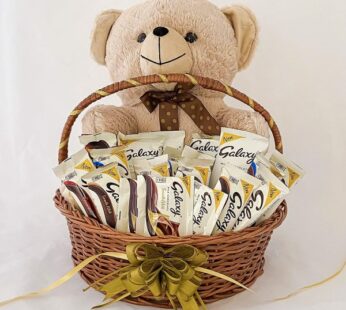 Appealing birthday gift for girlfriend in India adorned with a teddy & chocolates