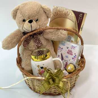 Cute birthday gifts for girlfriend adorned with a teddy bear, chocolates, and mug
