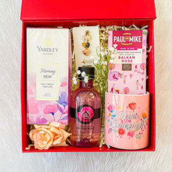 Enchanting gift for bride-to-be from friend, filled with chocolate, perfume, and more