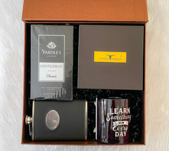 An unusual gift for groom to be, filled with a body spray, men’s belt, and a hip flask