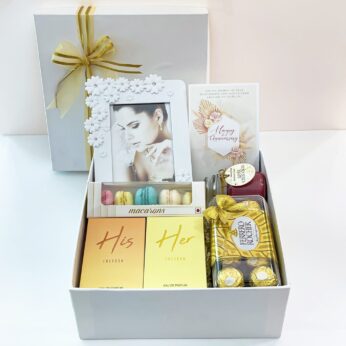 anniversary gift box for couple filled with perfumes, chocolates, photo frame