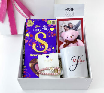 Rosy Dreams Women’s Day Gift Hamper With Chocolates, Nail Polish, Hair Clip, And More