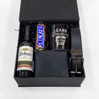 Surprise gift for groom on wedding day filled with grape juice, wallet, mug, and more