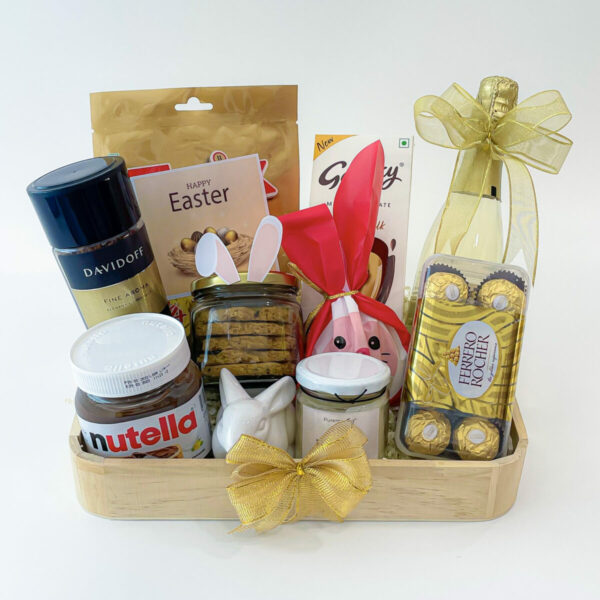 A personalized Easter gift box with a label that reads "Happy Easter" and filled with chocolates and Wine