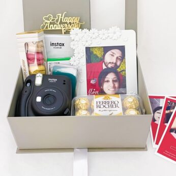Lovely 25th wedding anniversary gifts for him with chocolate, photo frame, and camera