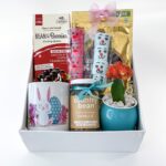 White Easter hamper box decorated with colorful gifts buy Easter Gifts India