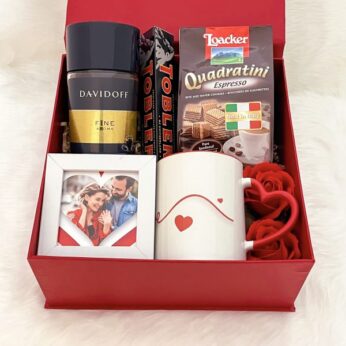 DIY anniversary gifts for him filled with customized mug, photo frame, and chocolates