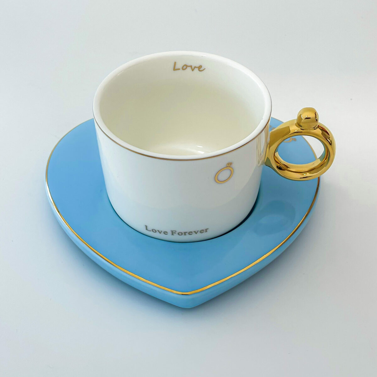 Ceramic mug with blue heart shape trey