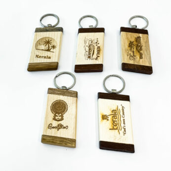 Handcrafted Kerala souvenir wooden keychains ( Height 7 cm, Width 4 cm, Length 1 cm.)