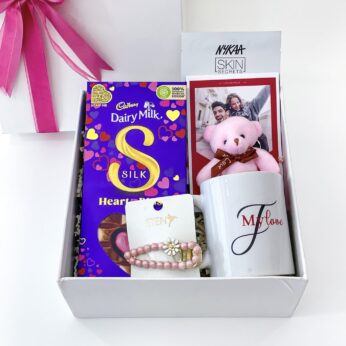 Customized Rakhi gift box for sister filled with Rakhi, Chocolate, Mug, and more