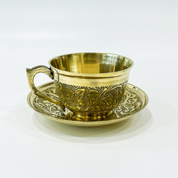 Golden brass cup with saucer